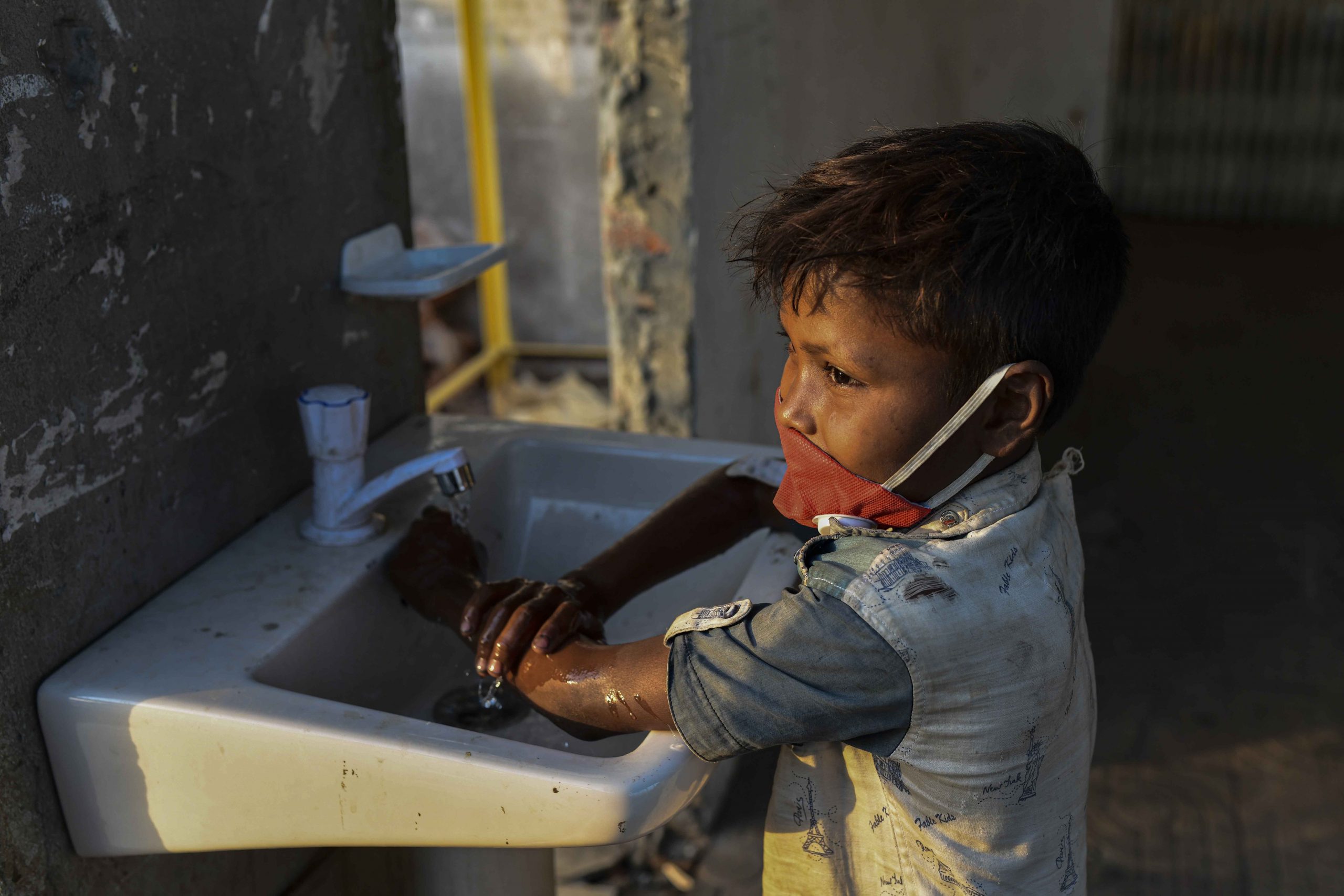 COVID-19’s Devastating Impact on Children 1 A child washing hands with anti-bacterial soap as a preventive measure against COVID-19, at Sadarghat Launch Terminal, in Dhaka, Bangladesh, on March 27, 2020.